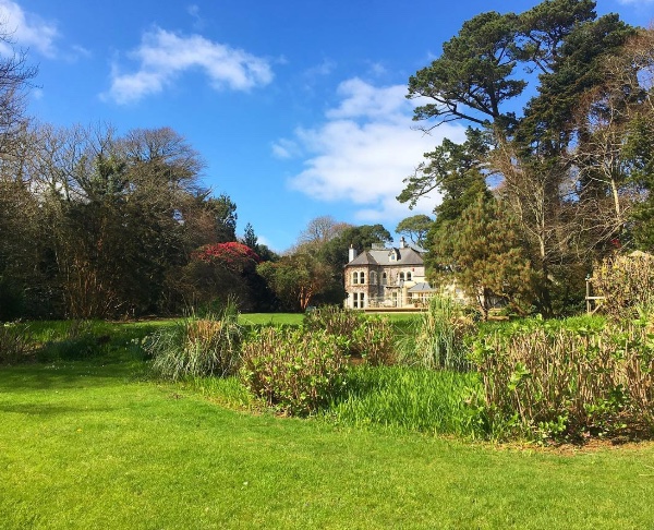the view from the bottom of the garden back up to the hotel
